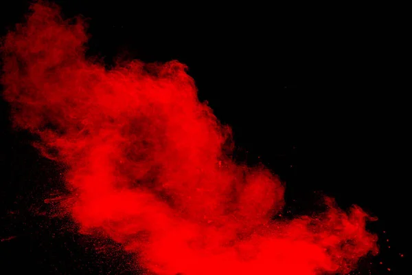 Rotes Pulver Explodiert Auf Schwarzem Hintergrund Gefrierbewegung Von Staubpartikeln Roter lizenzfreie Stockbilder