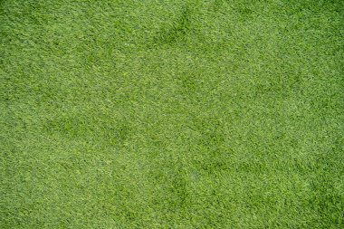 Yapay çayır yeşili. Üst Görünüm dokusu. Yeşil çimenler. Doğal arka plan dokusu. Taze bahar yeşili çimenler.