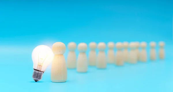 Outstanding people standing with light bulb icon out from the crowd. Human resource, Talent management, Recruitment employee, Successful business team leader concept.