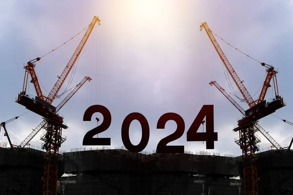 Black silhouette staff works as a to prepare to welcome the new year 2024. Large construction site, many construction cranes set vector numbers 2024. Construction team sets numbers for New Year 2024.