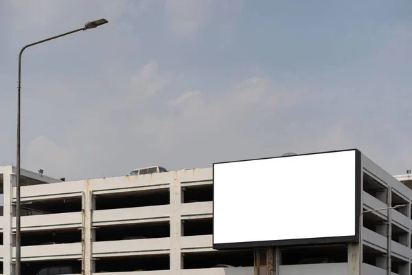 A large blank billboard on the street wall, a billboard with room to add your own message. The billboard on the building is ready for new advertising.