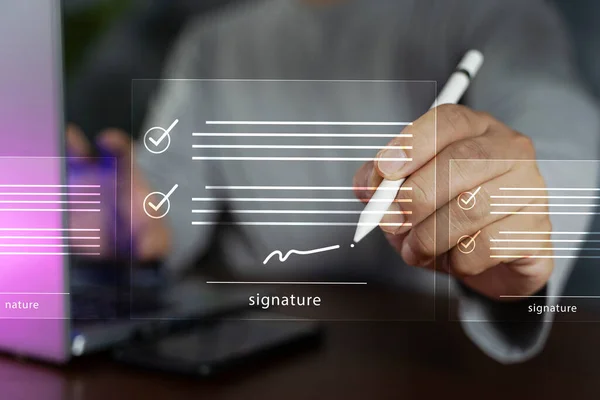 Electronic signature concept, business people sign electronic documents on digital documents, paperless office,future business contract signing. Paperless workplace idea,e-signing,electronic signature