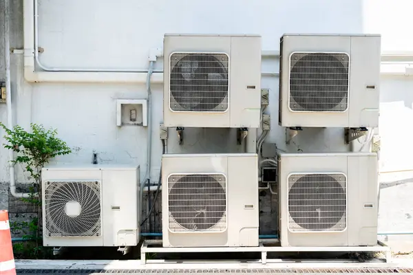 Air compressors concept. Air conditioning (HVAC) installed on the roof of industrial buildings.