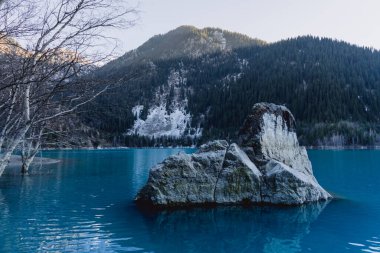 beautiful view of the Issyk lake in the mountains of Kazakhstan clipart