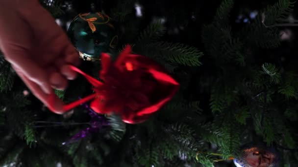 Woman Hand Hanging Christmas Heart Shape Decoration Artificial Christmas Tree — Stock Video