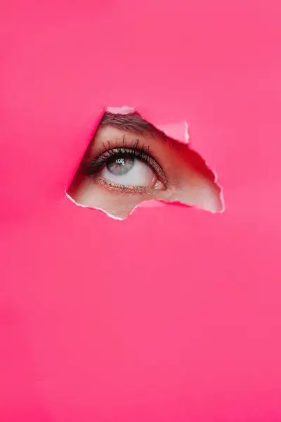 Eye Beautiful Woman Looking Hole Pink Paper Glamour Woman Beauty Stok Foto Bebas Royalti
