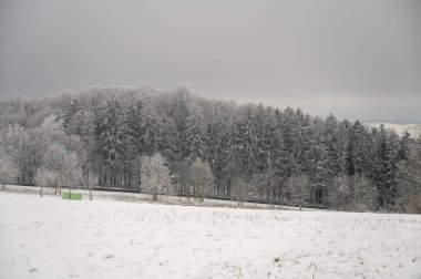 Beautiful winter landscape with lots of snow and trees in odenwald, germany