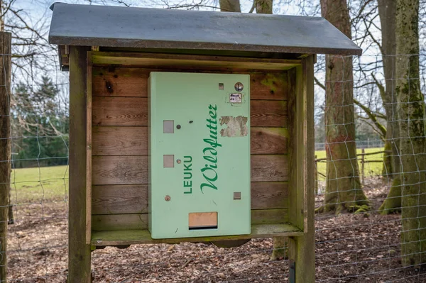 Close-up animal food machine for guests, guests can buy small bags of food for animals in Safari Park Englischer Garten, Eulbach, Germany