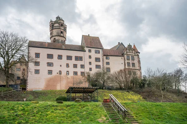 View of the beautiful Ronneburg Castle during cloudy day, meadow in front, low angle view Germany