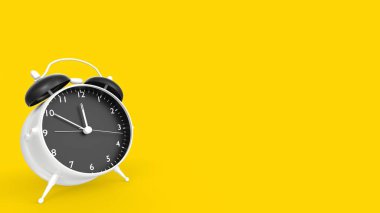 alarm clock on yellow background. time for your design.