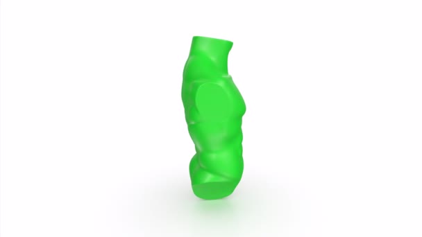白い背景に隔離された緑のプラスチックキャンディー — ストック動画