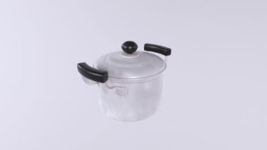 Mutfak arka planında paslanmaz çelik tencere var.