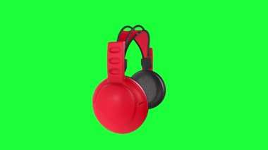 Yeşil arkaplanda izole kulaklıklar