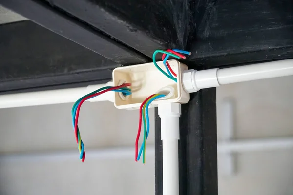 Electrician repair wire in PVC Conduit , renovate home.