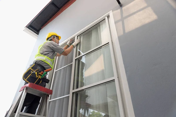 Construction Worker Repairing Sliding Window Open Cap Adjust Rail Wheel — Stock Photo, Image