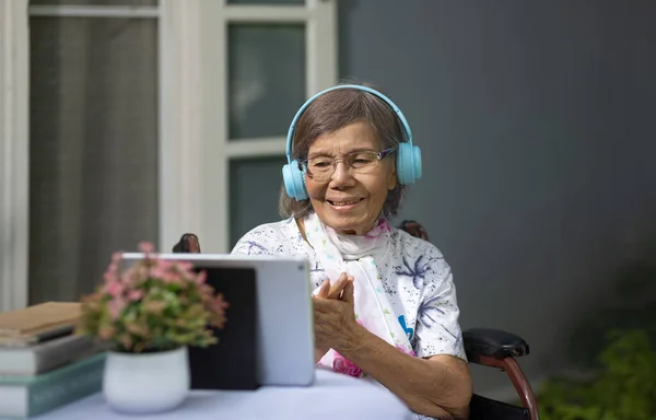 Music therapy in dementia treatment on elderly woman.