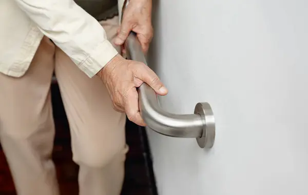 Stock image Elderly Woman Holding Handrail for Support