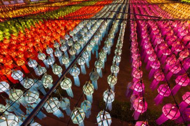 Paper lanterns in the Yee Peng Festival decorate around Lumphun downtown, Thailand. clipart