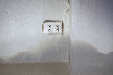 The Risks of Mud in Wall Outlets After a Flood clipart