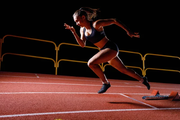 Young Sportswoman Doing Explosive Start Starting Blocks Her Running Lane Image En Vente