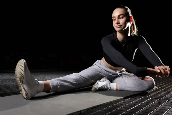Young Fitness Girl Stretching Her Legs Mat Gym Isolated Black — Stock Photo, Image