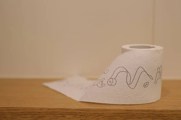 children's drawings toilet paper, stands in the toilet, modern toilet paper design