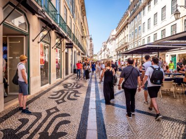 View of the historic architecture of Lisbon in Portugal showcasing the Rua do Comercio Street and the Praca do Comercio Street on a sunny day.