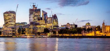 Panoramic view of London in the UK by the Thames River. clipart