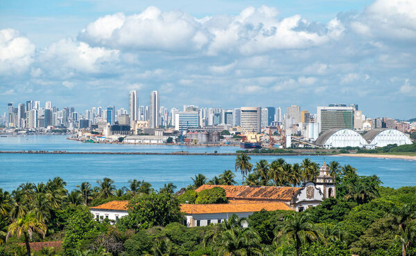 The skyline of the Brazilian city of Olinda and Recife in Pernambuco, Brazil on a sunny summer day.