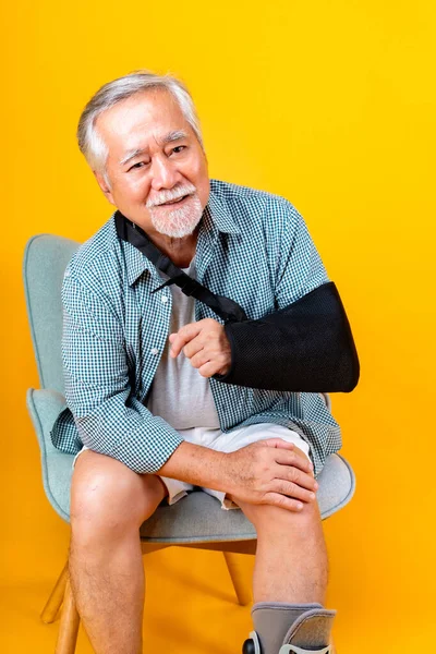 asian elderly man broken arm wear arm splint for treatment confident lifestyle medical care.