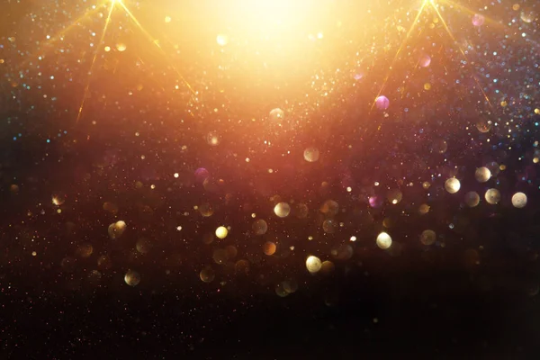 Background Abstract Glitter Lights Gold Black Focused — Stock Photo, Image