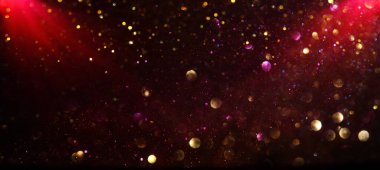 Soyut kırmızı, altın ve siyah parıltılı ışıkların arkaplanı. Odaklanamadı