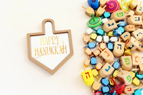 image of jewish holiday Hanukkah background of spinning tops