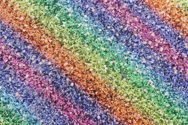 Parıltılı pastel ışıklar arka planda. kırmızı, altın, mor, yeşil ve mavi. Odaklanmamış