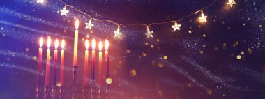 Image of jewish holiday Hanukkah with menorah (traditional candelabra) and candles clipart