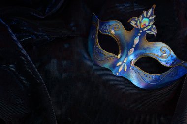 Image of elegant venetian mask over dark background