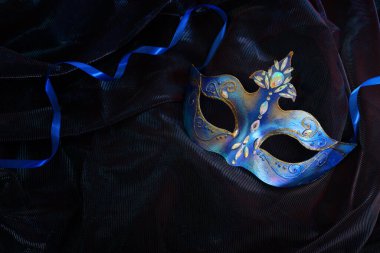 Image of elegant venetian mask over dark background