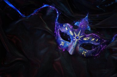 Image of elegant venetian mask over dark background