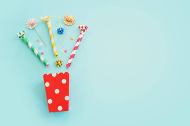 Top view image of party and present objects on pastel background