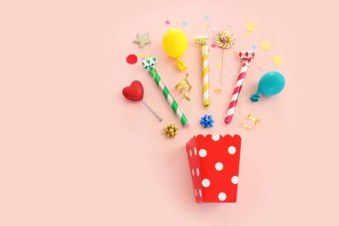 Top view image of party and present objects on pastel background