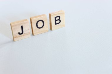The word job written on wooden cubes over white background