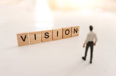 The word vision written on wooden cubes over white background