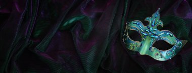Image of elegant venetian mask over dark background