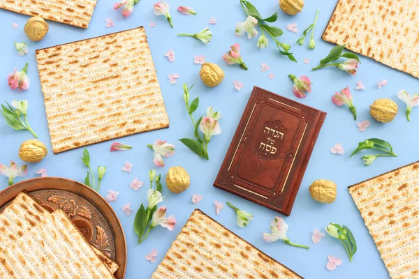 Pesah celebration concept (jewish Passover holiday). Translation of Traditional pesakh book with text: passove tale