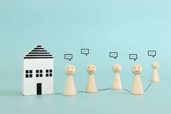 Concept image of family, communication and home. Wooden figures and speech bubbles