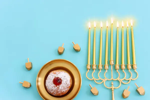 Religion image of jewish holiday Hanukkah background with menorah (traditional candelabra). Top view