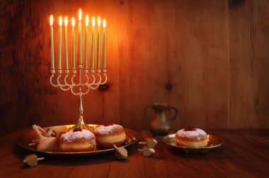 Religion image of jewish holiday Hanukkah background with menorah (traditional candelabra) and candles clipart