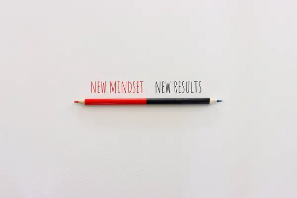 top view image of pencil with the text new mindset. success and personal development concept