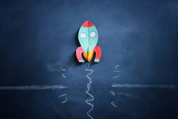 Rocket Overcoming Barrier Obstacle Blackboard Background Royalty Free Stock Images