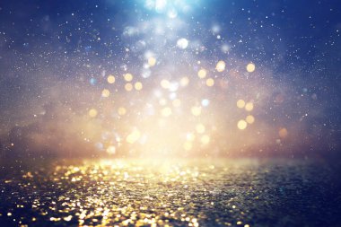 soyut glitter ışıkları arka plan. mavi, altın ve siyah. de odaklı